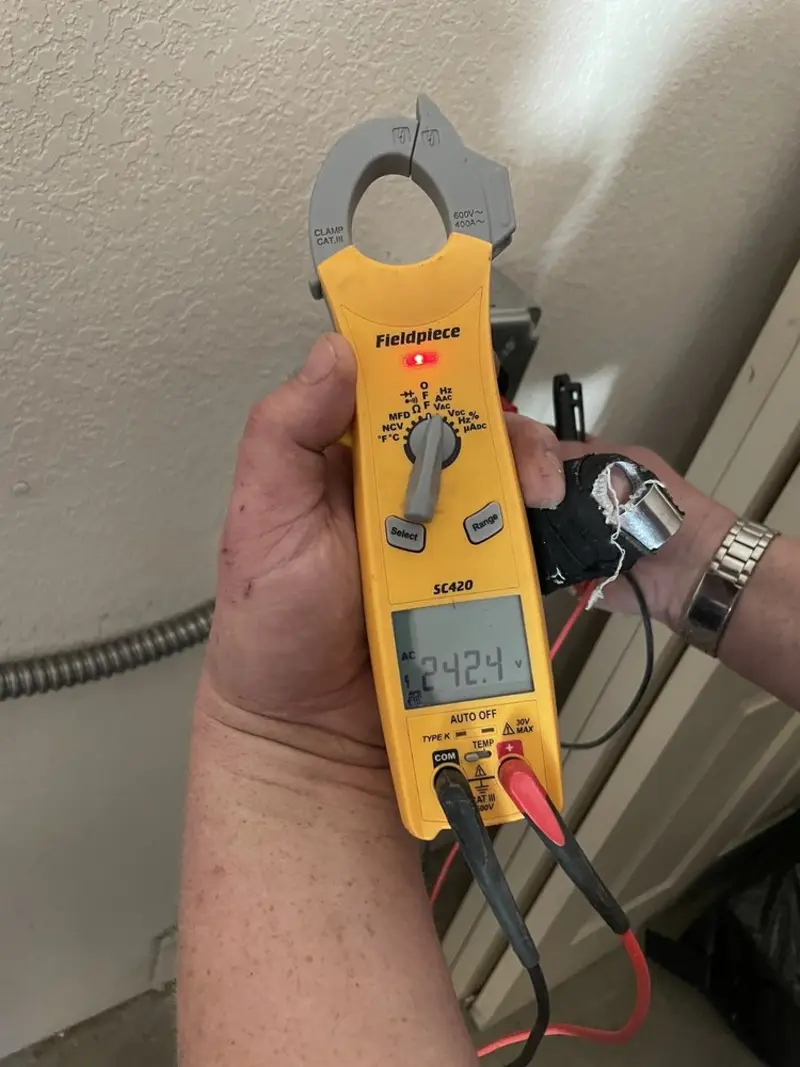 Voltage testing with clamp meter during Electrical Installation Services in La Vista